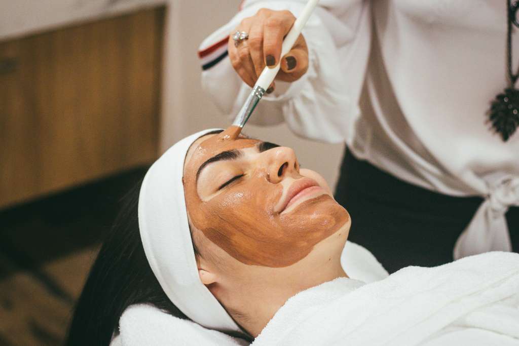 Expert performing integrative dermatology treatment